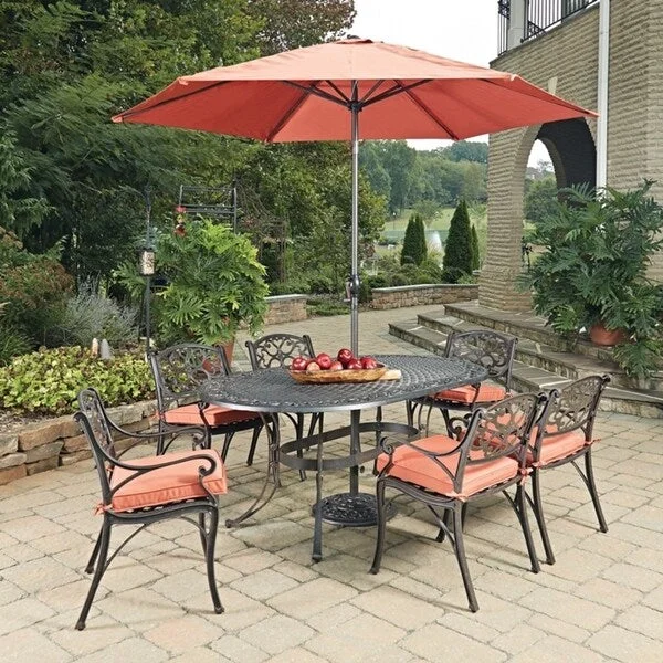 Biscayne Rust Bronze Oval 9 Pc Outdoor Dining Table, 6 Arm Chairs with Cushions & Umbrella with Base by Home Styles