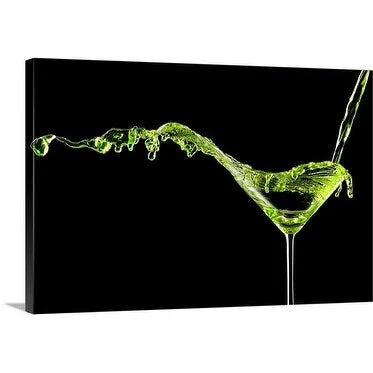 Premium Thick-Wrap Canvas entitled Big apple martini splashing out of the glass during pour.