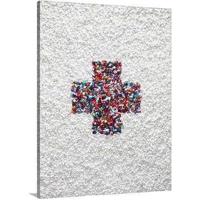 Premium Thick-Wrap Canvas entitled The First Aid symbol formed by colored pills surrounded by white pills